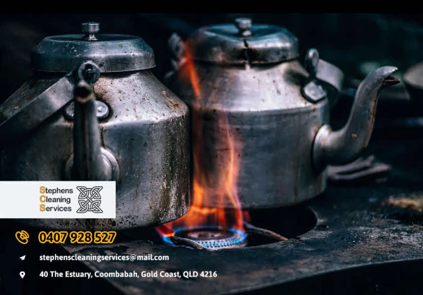 Burnt food in a cooking pot on a stove