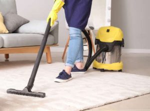 Domestic cleaning of carpet with mopping