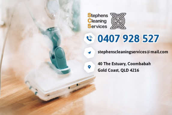 A steam mop and cleaning solution on a wooden floor