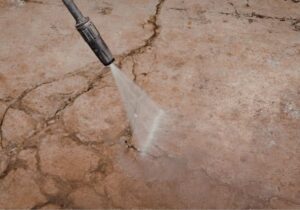 can pressure washing damage concrete